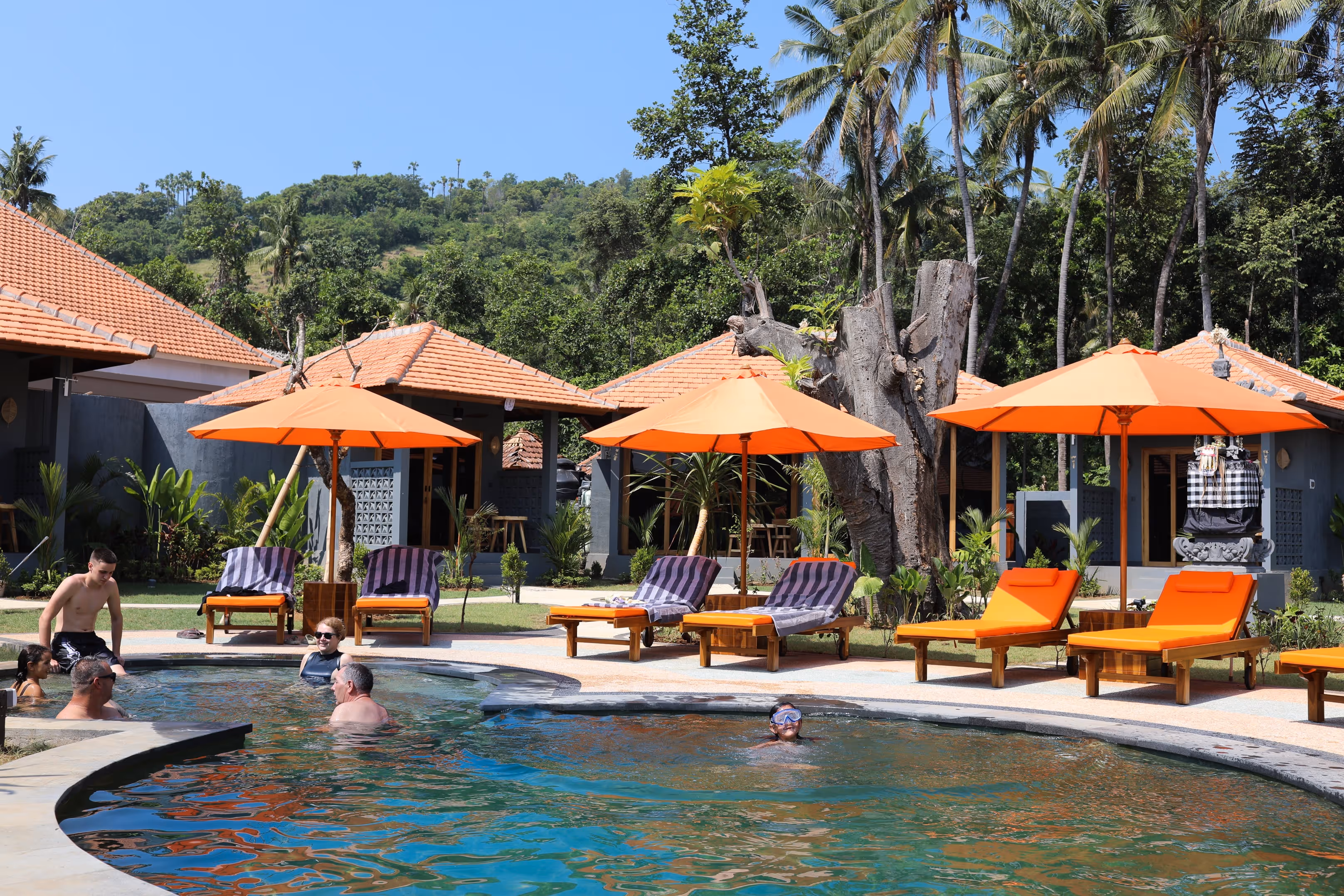 Pool and sun loungers at Aqua Dive Resort Amed