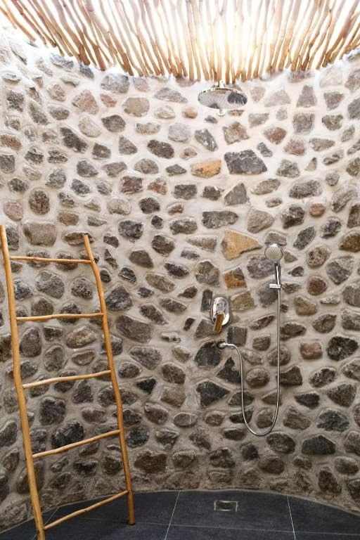Family bungalow: open-air stone shower