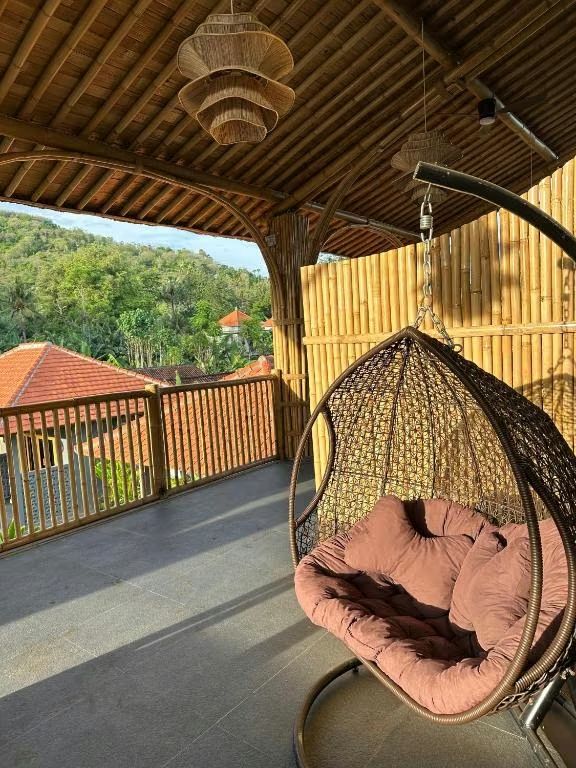 Suite balcony with a hanging chair