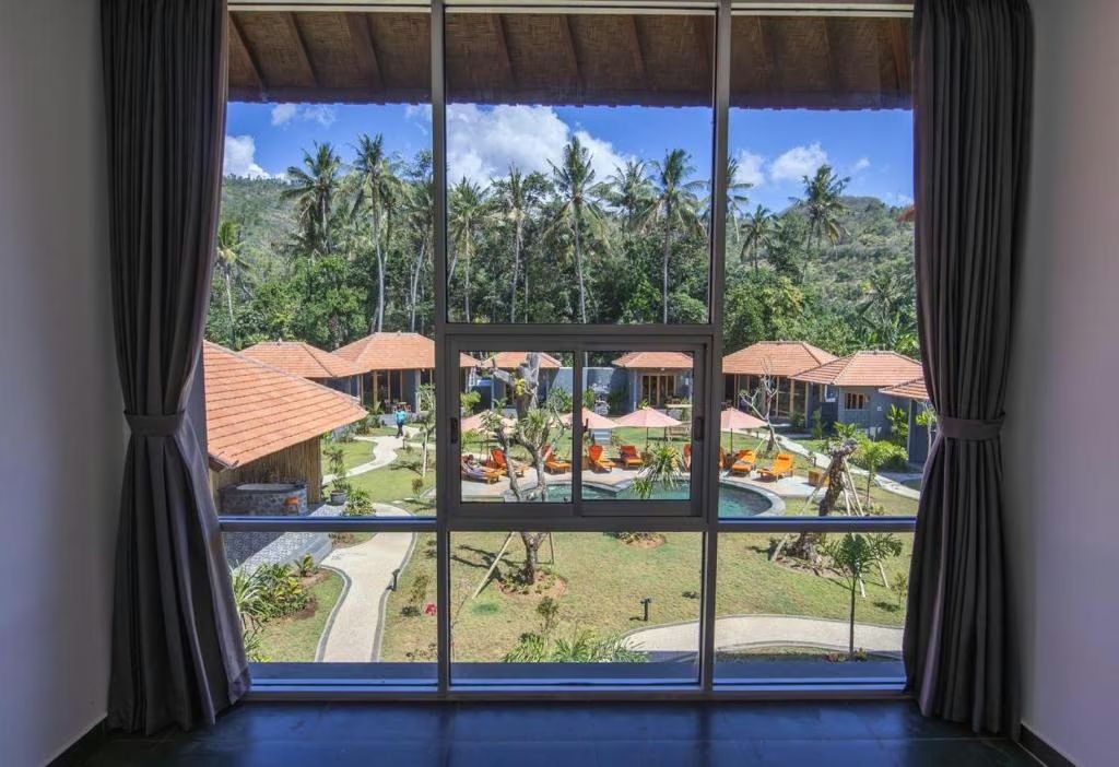 View over the bungalows and pool from the villa
